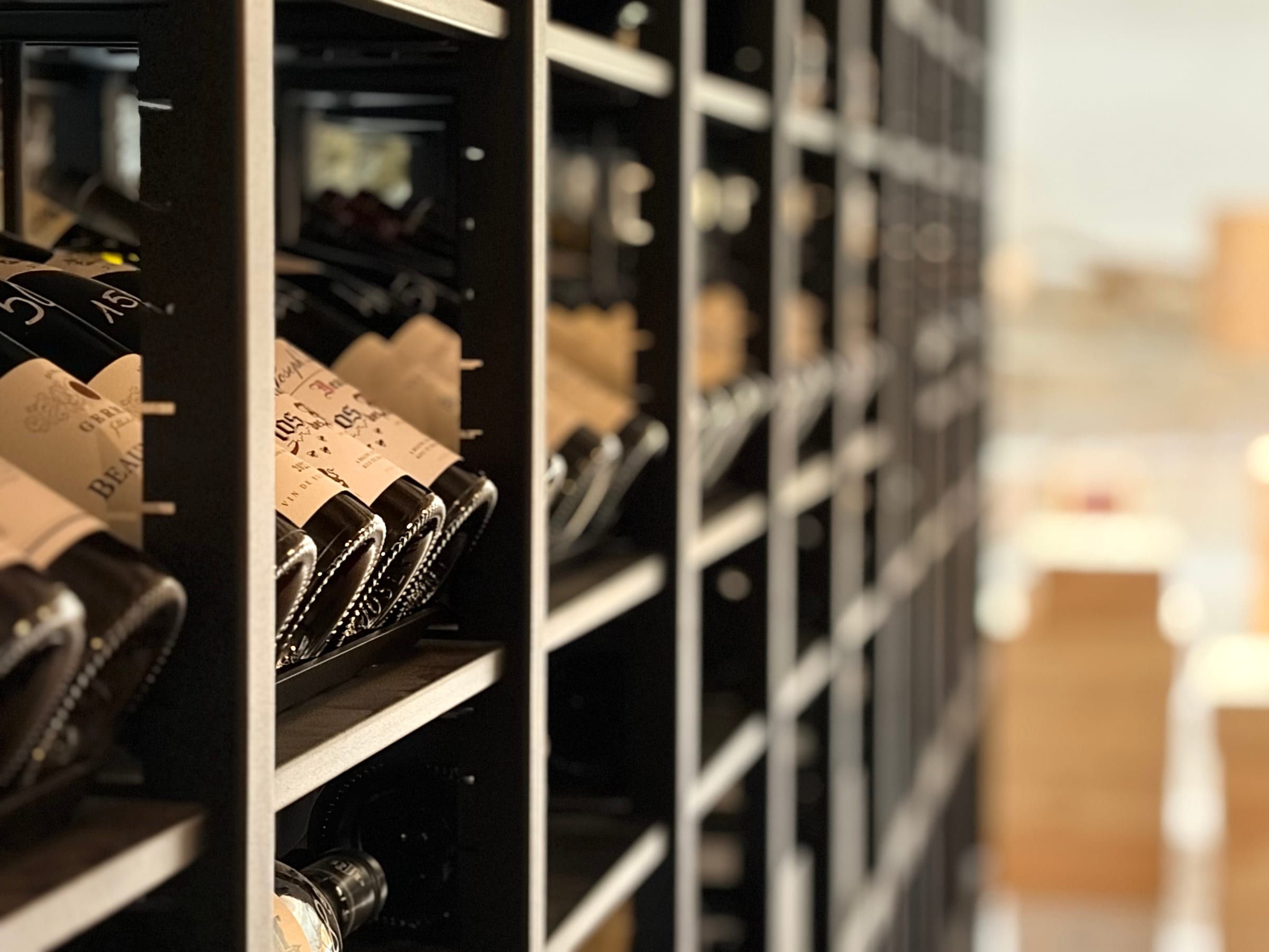 Cellar racks with a selection of Beaujolais and Burgundy wines
