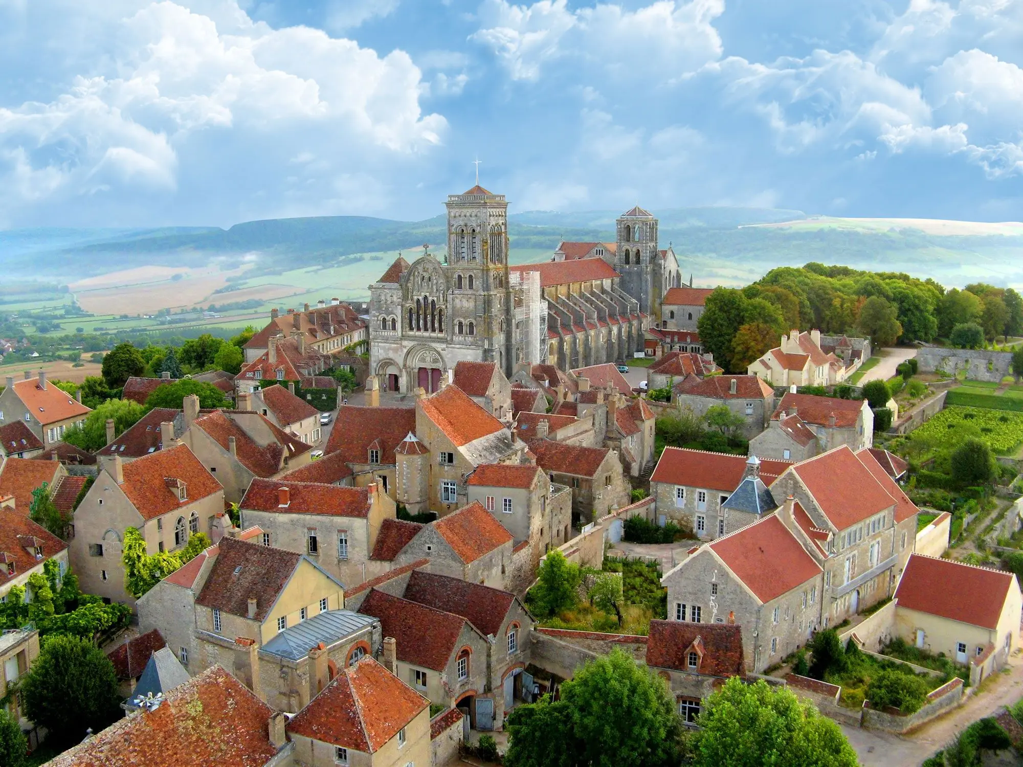 Aerial view from a hot-air balloon of the hill of Vézelay crowned by the Sainte-Marie-Madeleine basilica