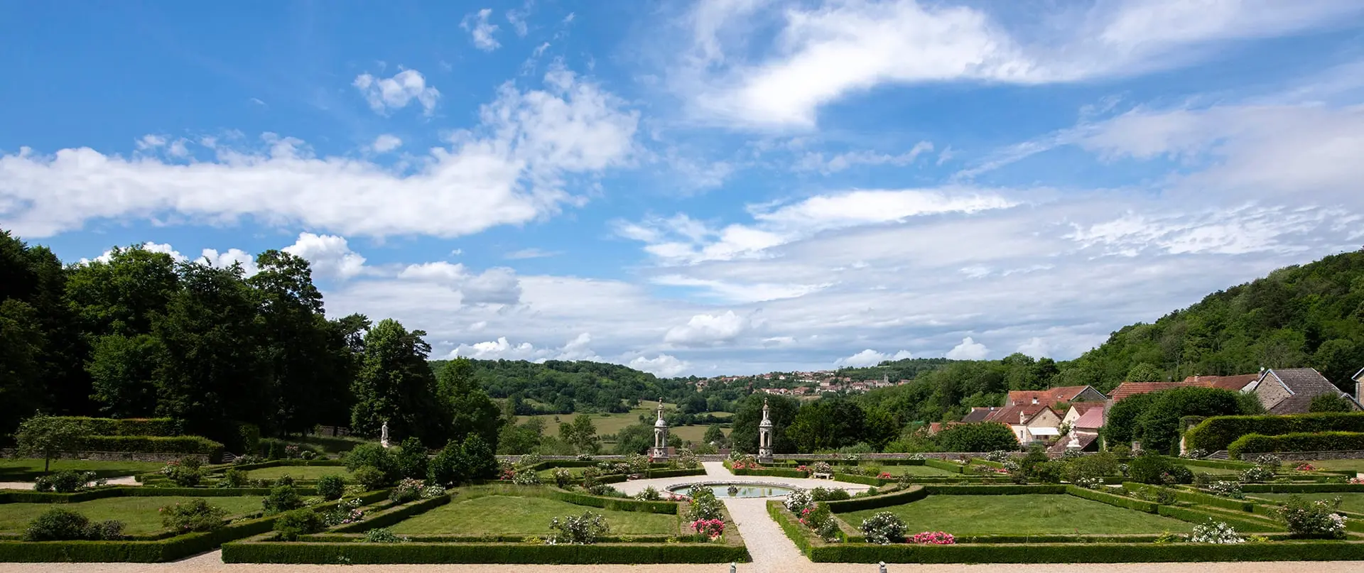 Panoramic view of the formal French gardens of the Château de Bussy-Rabutin
