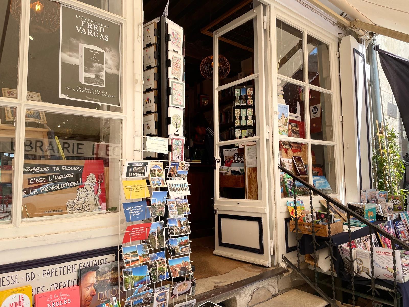 Entrance of the L'Écritoire bookshop on the Place Notre-Dame in Semur-en-Auxois, an independent general bookshop