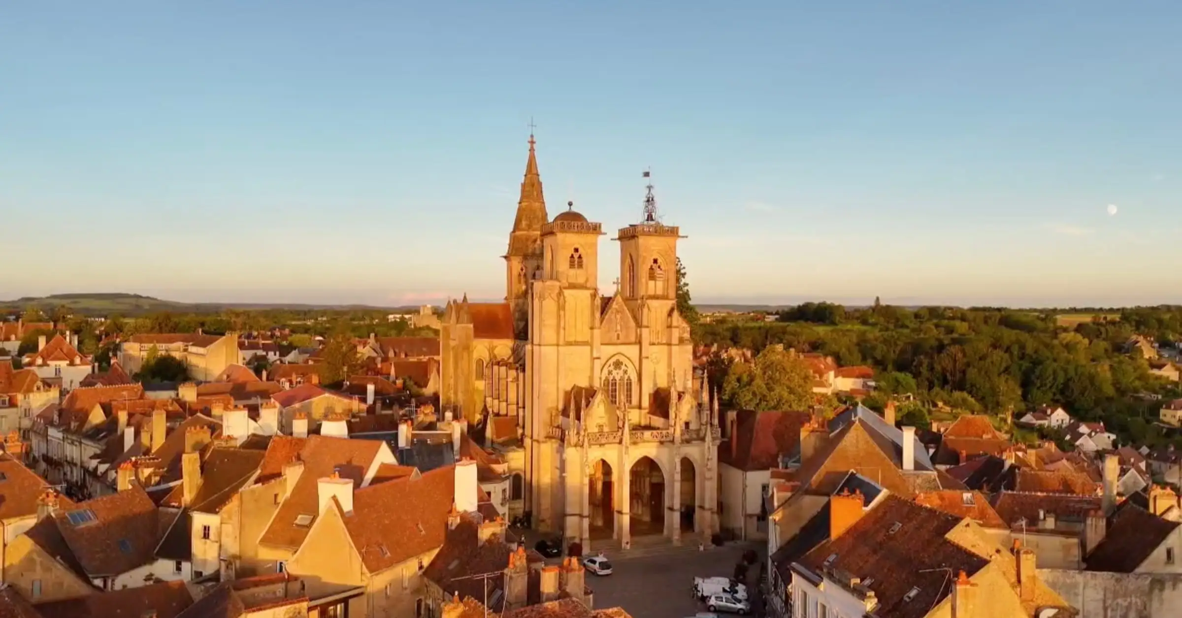 Aerial view of Semur-en-Auxois at sunset with the Notre-Dame collegiate church