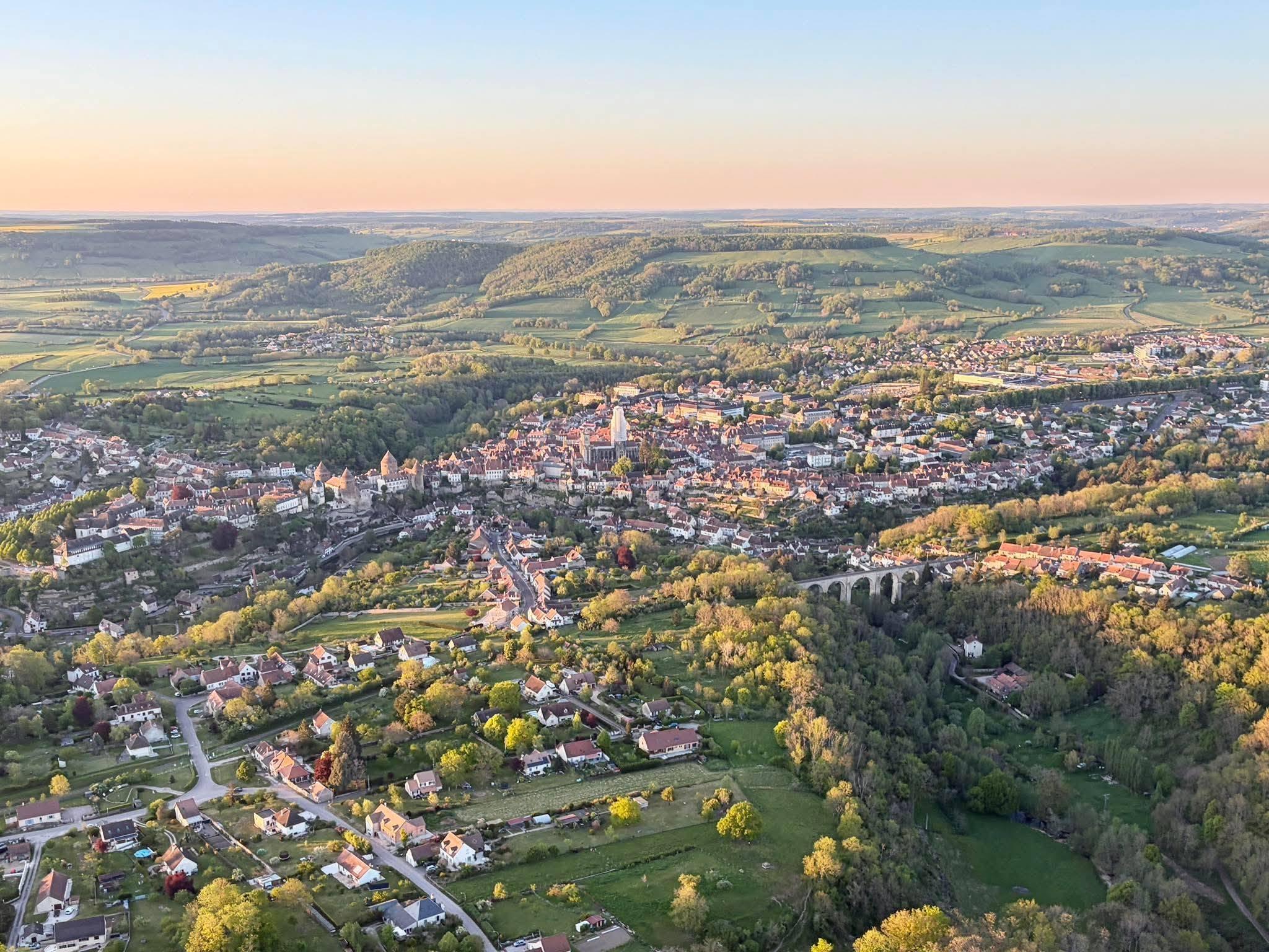 Aerial view of the medieval town of Semur-en-Auxois and its viaduct at sunset, in the Auxois countryside of Burgundy