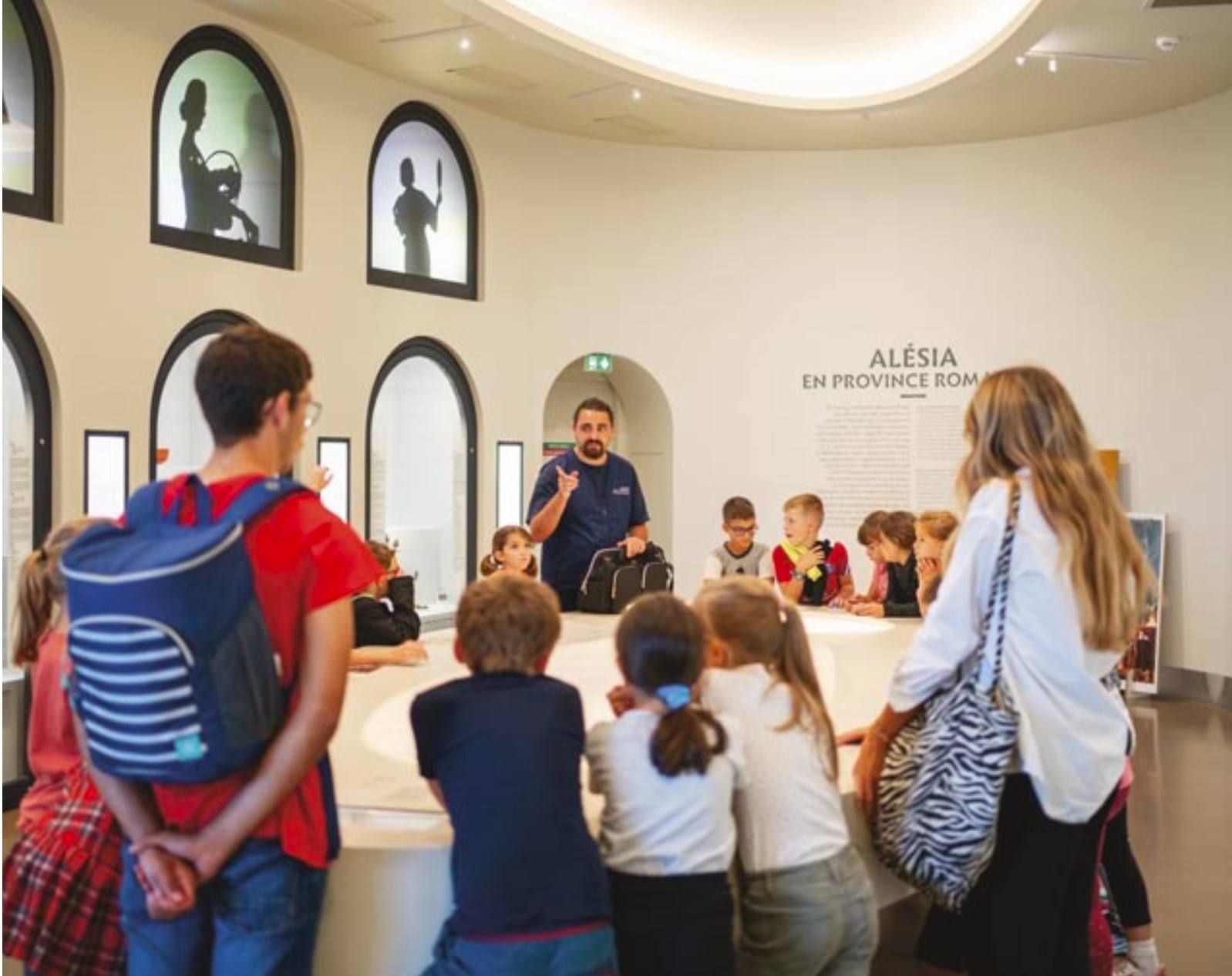 Guided tour at MuséoParc Alésia, in front of the 'Alésia in the Roman province' display